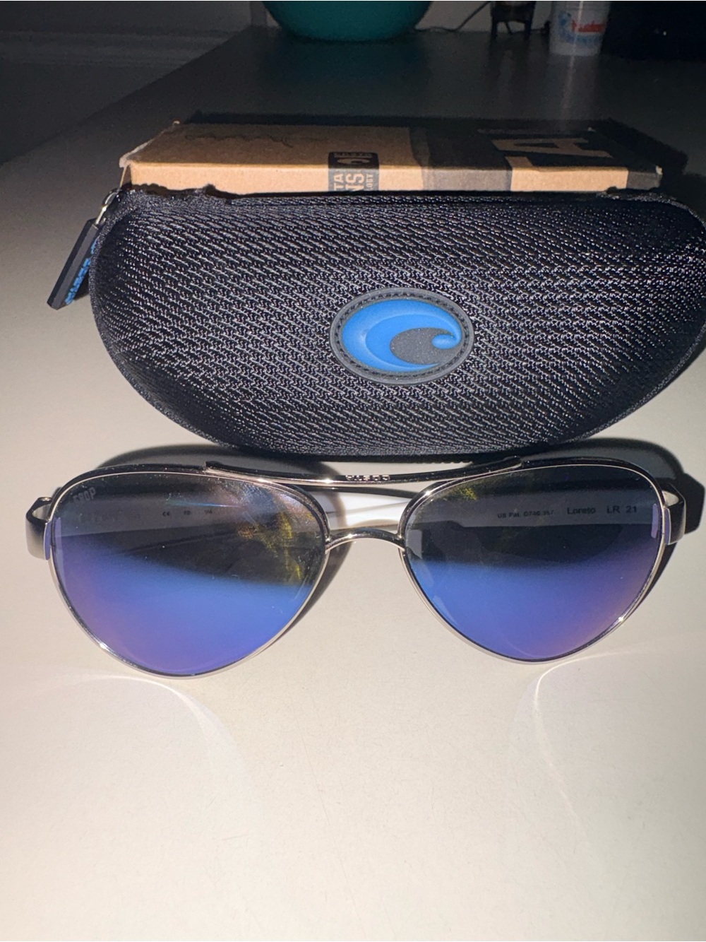 Costa Loreto Silver Frame Women’s Sunglasses with Blue Mirrored Lenses